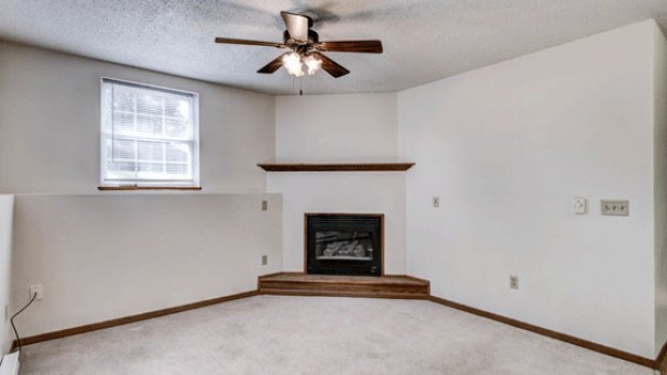 Living Room featuring Corner Fireplace